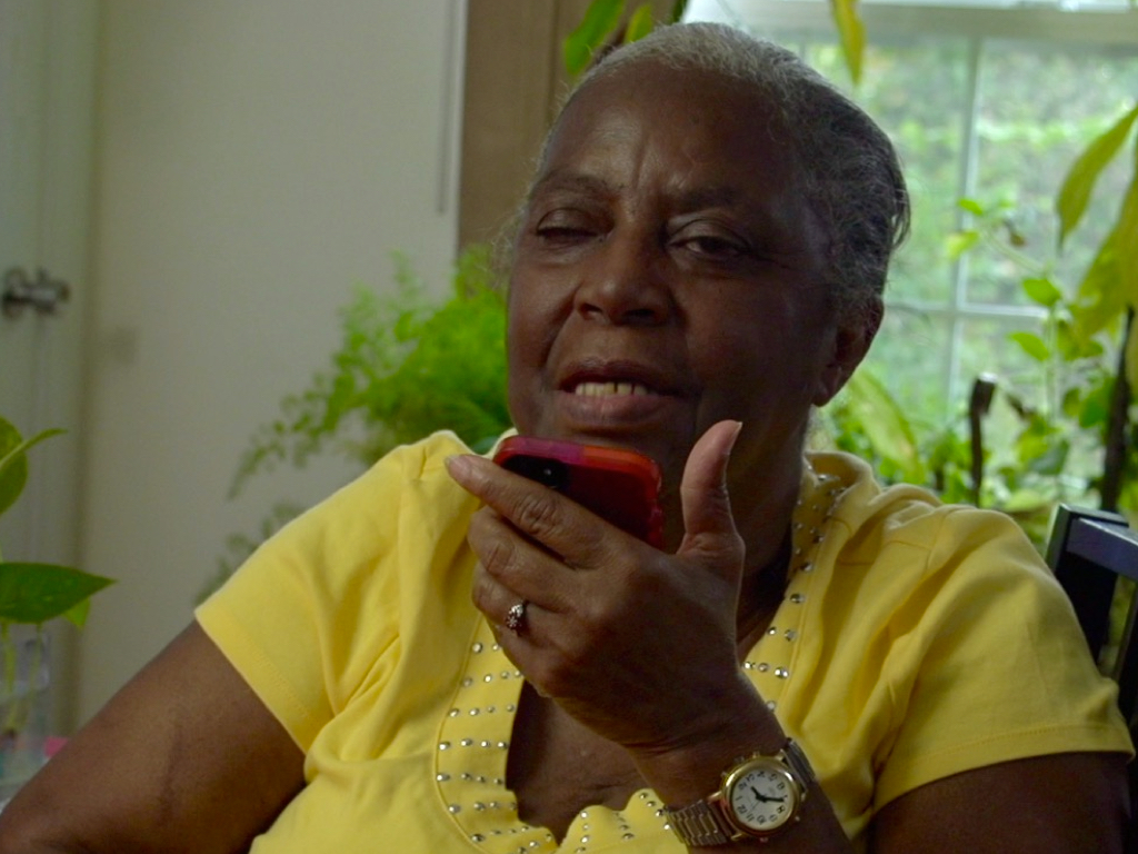 Black woman speaking into phone