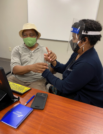 A program participant receiving instruction on how to use the assistive technology.